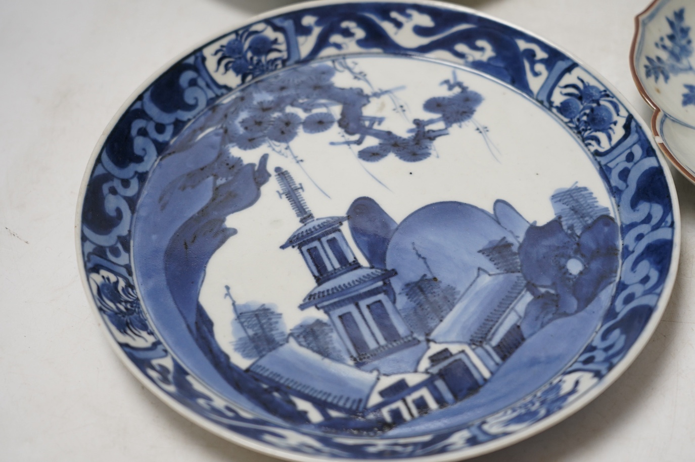 Three Japanese Kakiemon style blue and white dishes and an 18th century Chinese famille rose dish. Condition - varies